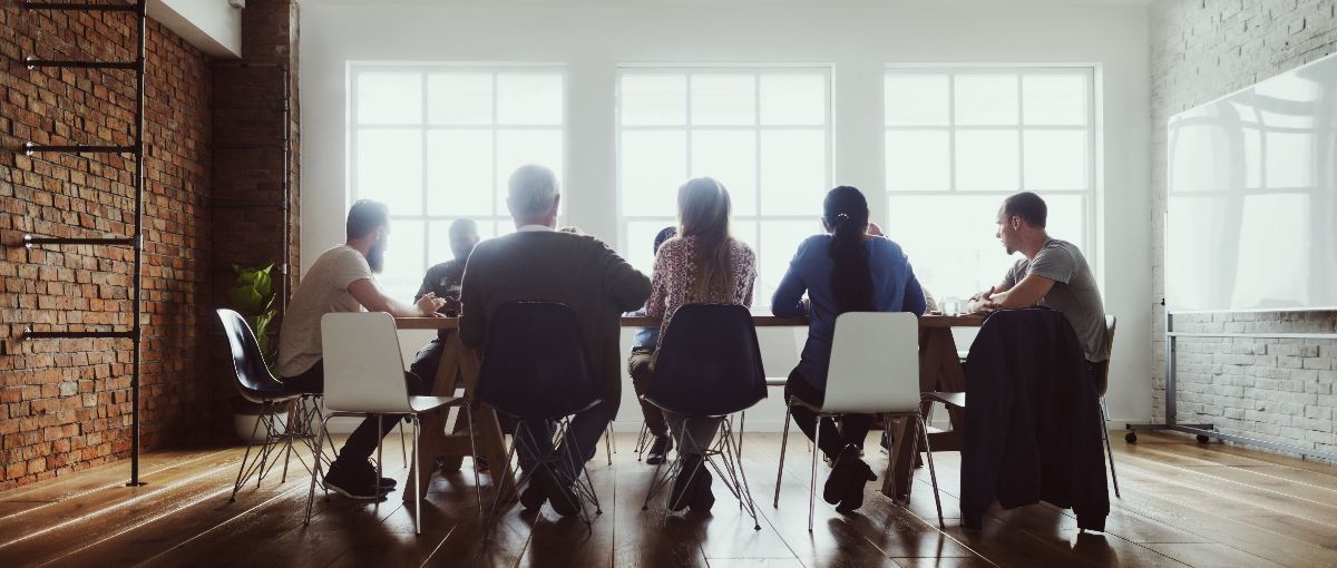 group seated at boardroom table