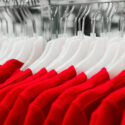 close up red dresses on hangers